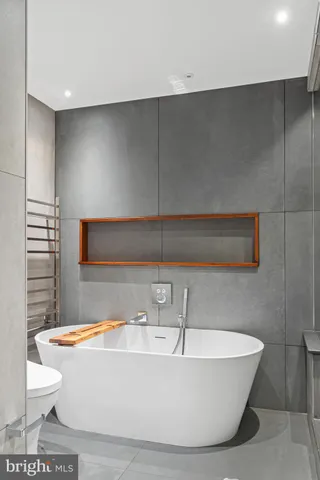 a white bath tub sitting in a bathroom