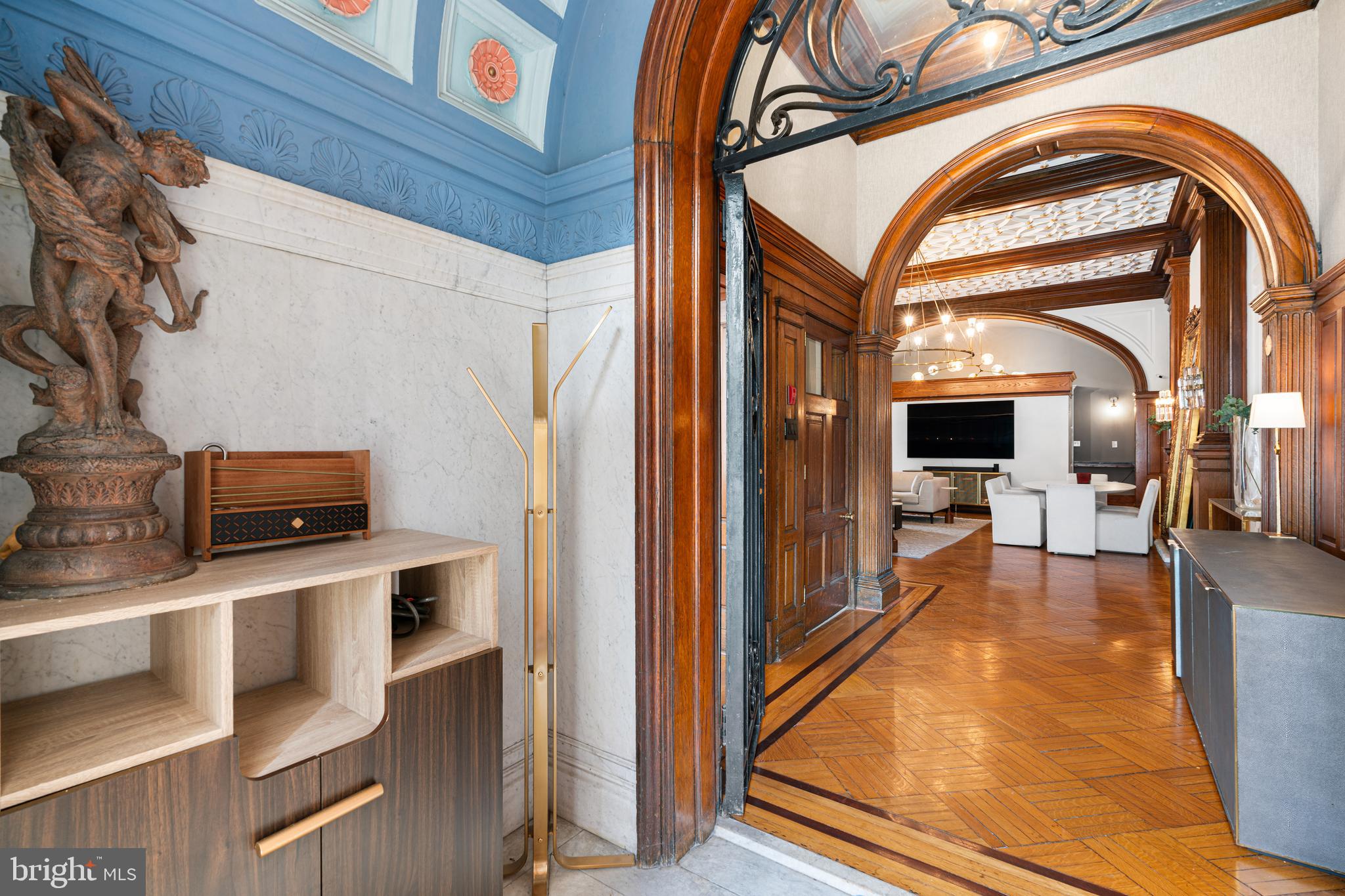 251-59 South 22nd Street, Unit A Philadelphia, PA 19103 - Photo 3 of 37 a view of a living room with a fireplace and a flat screen tv
