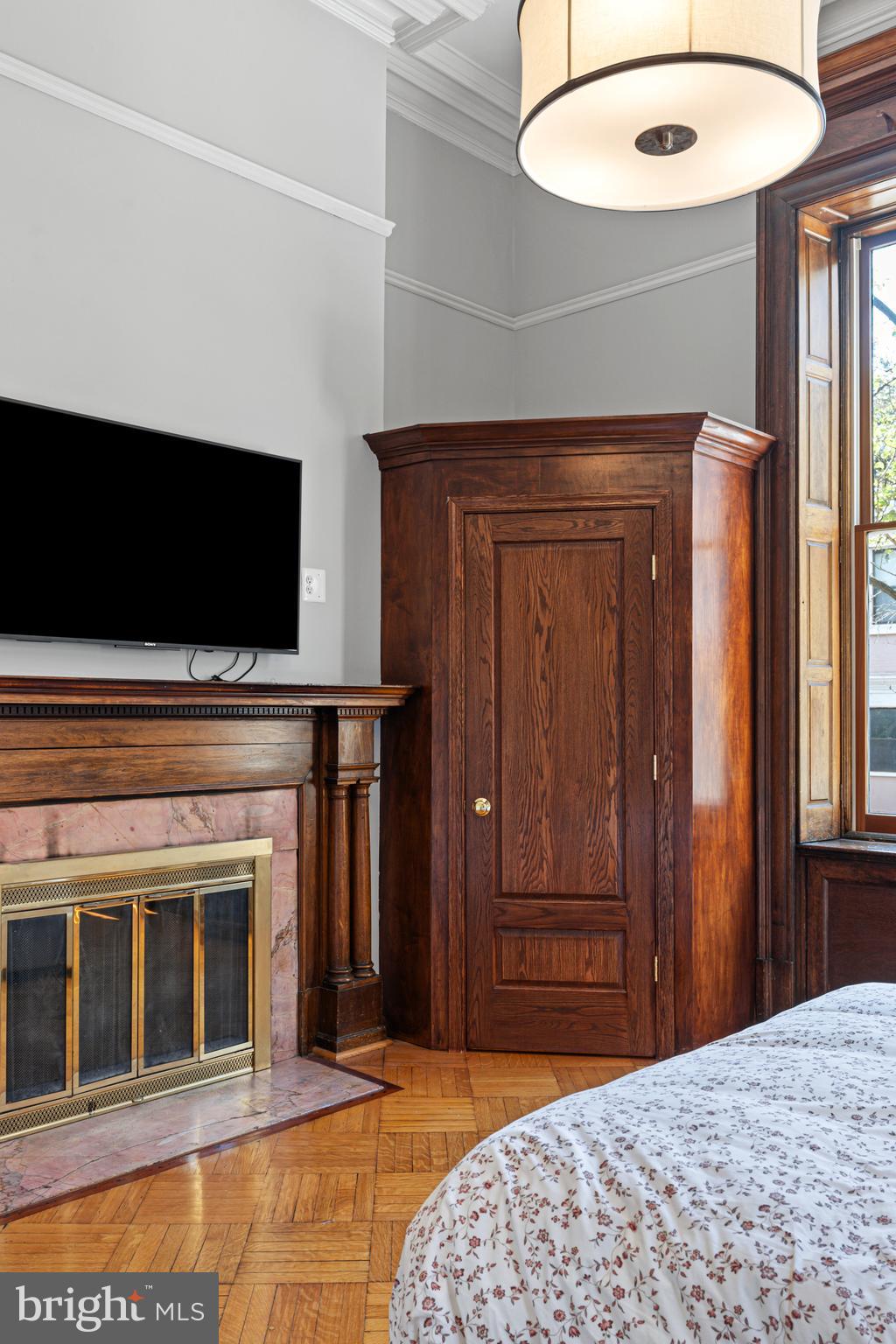 251-59 South 22nd Street, Unit A Philadelphia, PA 19103 - Photo 32 of 37 a bedroom with a bed and a flat screen tv