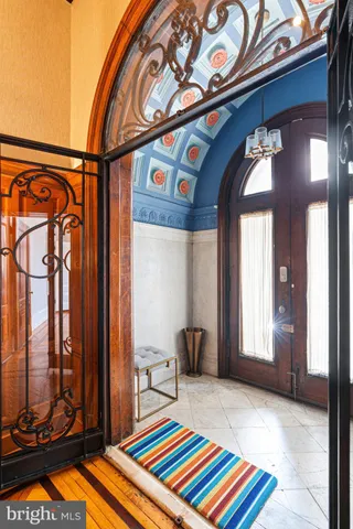 a bedroom with a bed and glass door