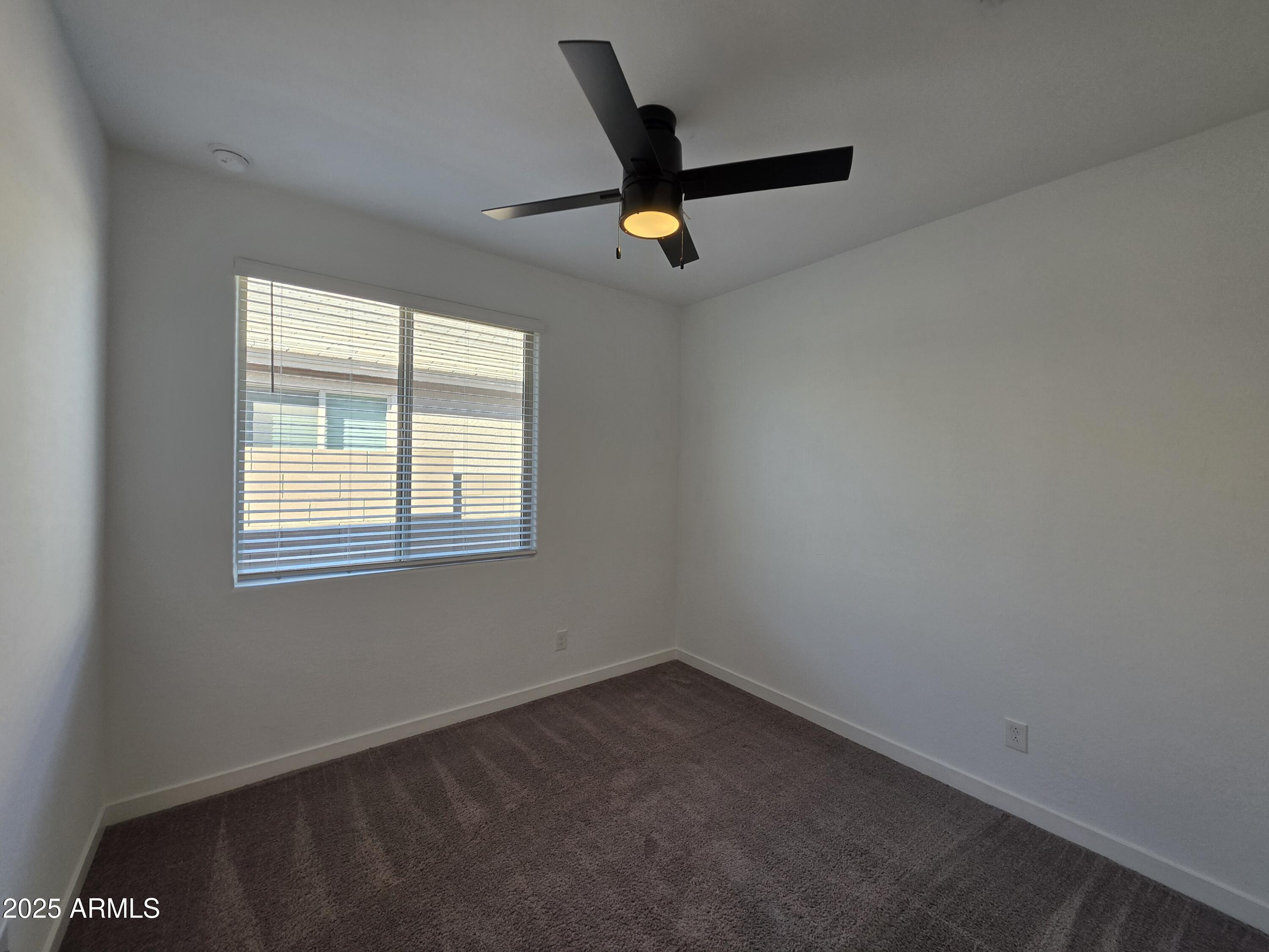 319 Pinnacle Ridge Drive San Tan Valley, AZ 85140 - Photo 14 of 25 an empty room with a window