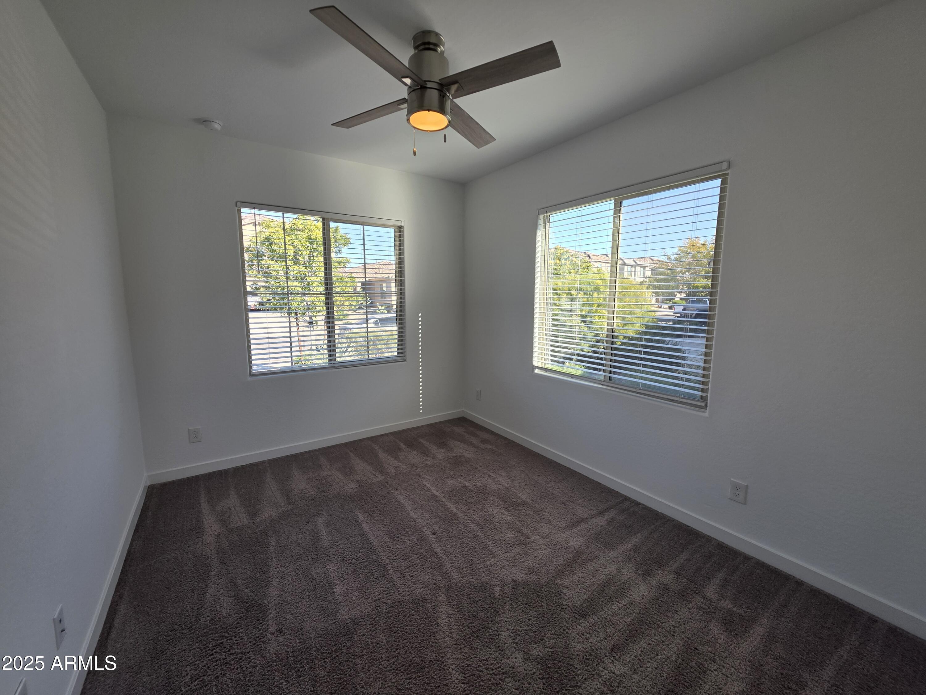 319 Pinnacle Ridge Drive San Tan Valley, AZ 85140 - Photo 18 of 25 a view of an empty room with windows
