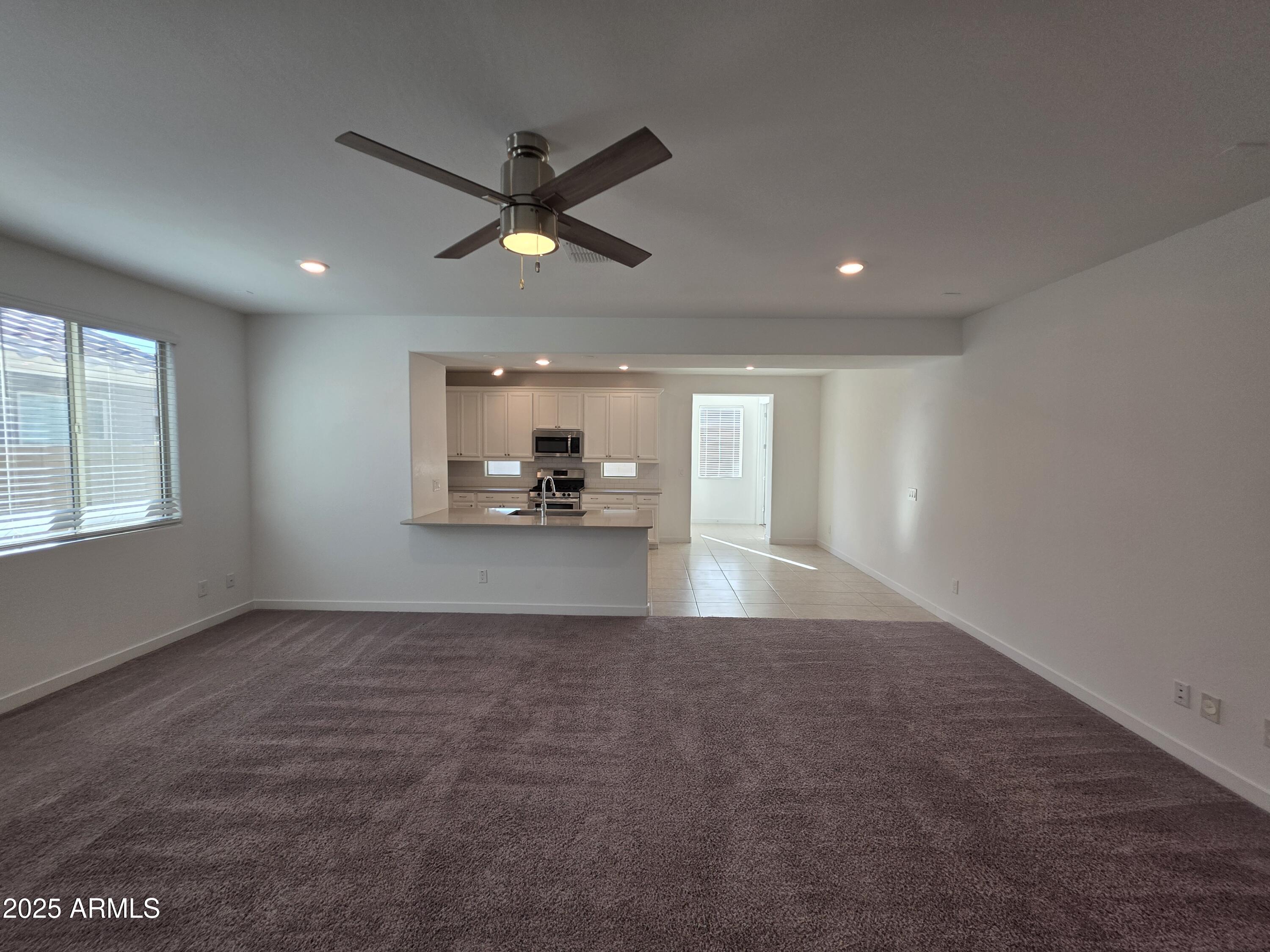 319 Pinnacle Ridge Drive San Tan Valley, AZ 85140 - Photo 2 of 25 a view of a kitchen with a sink and a window