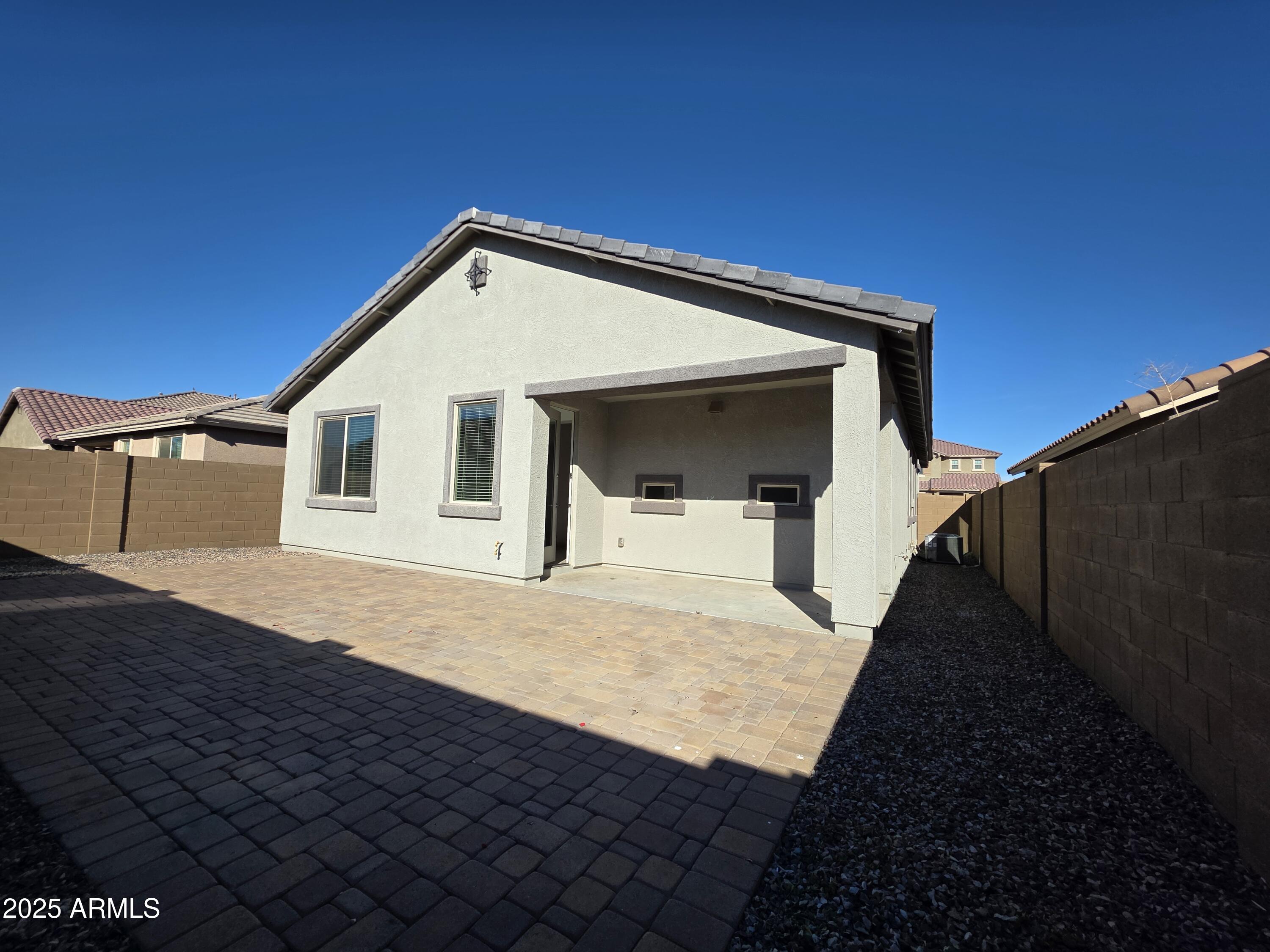 319 Pinnacle Ridge Drive San Tan Valley, AZ 85140 - Photo 22 of 25 a view of a house with wooden fence