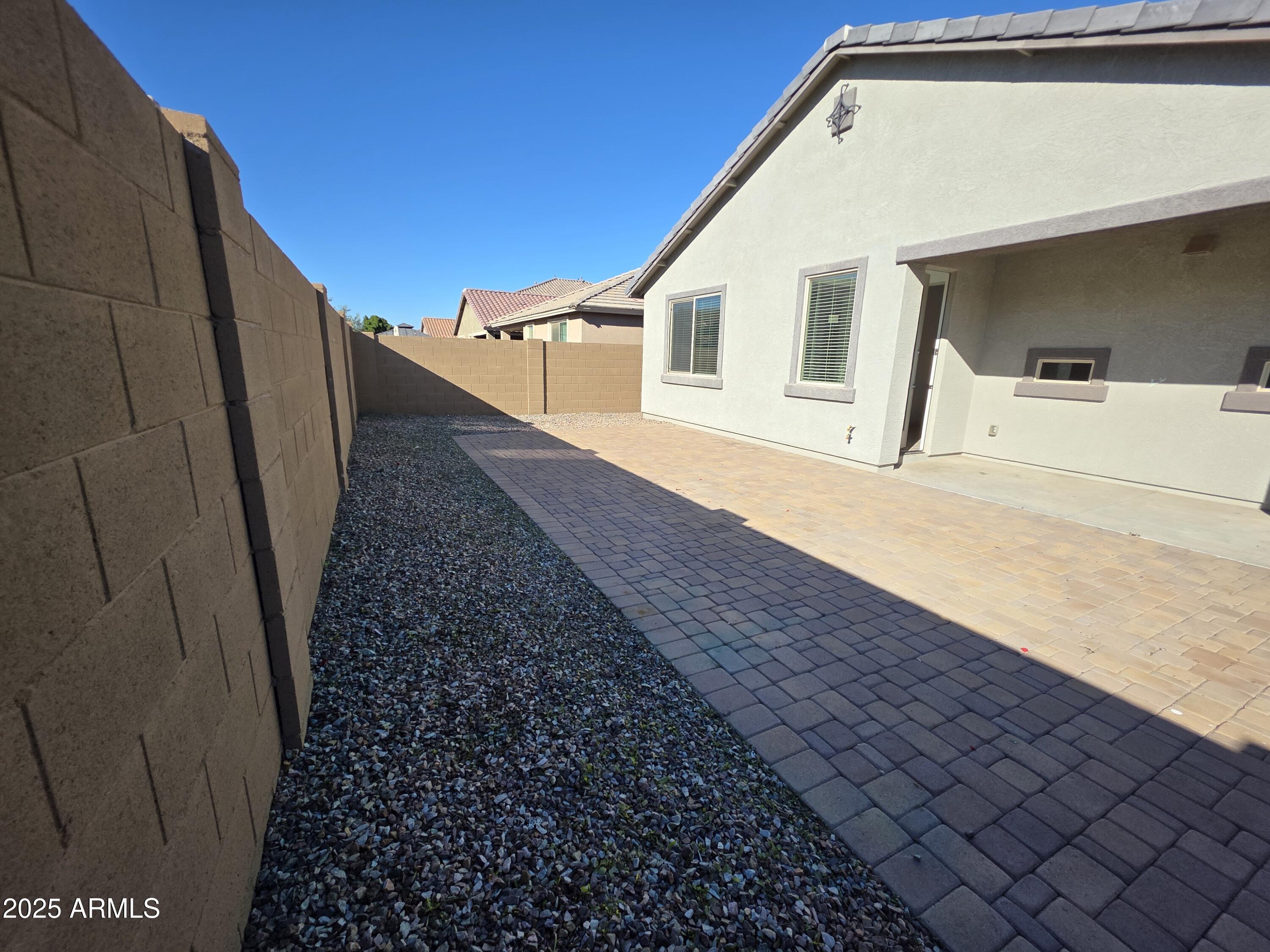 319 Pinnacle Ridge Drive San Tan Valley, AZ 85140 - Photo 23 of 25 a view of a house with a backyard
