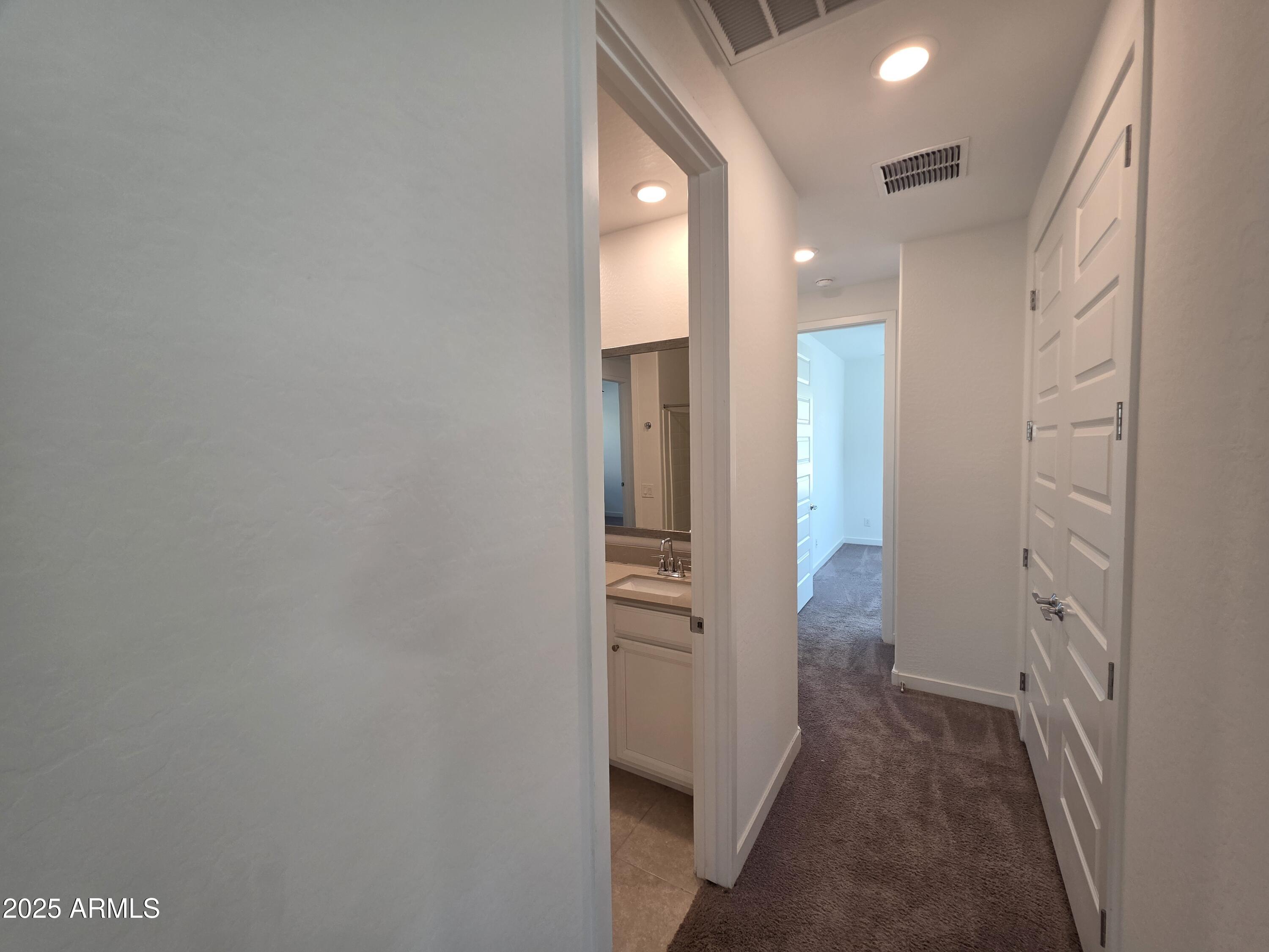 319 Pinnacle Ridge Drive San Tan Valley, AZ 85140 - Photo 6 of 25 a view of hallway with wooden floor
