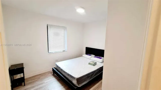 a room with table and flat screen tv