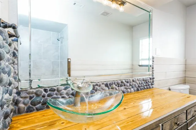 a bathroom with a tub and sink