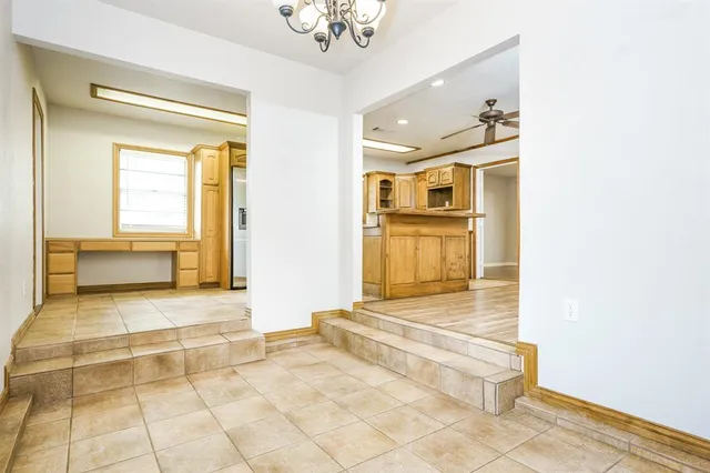a bathroom with a tub shower and a sink
