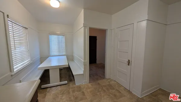 wooden floor with closet in an empty room