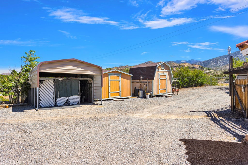 9072 Green Road Pinon Hills, CA 92372 - Photo 59 of 70 metal port with dog kennels, 2 storage sheds
