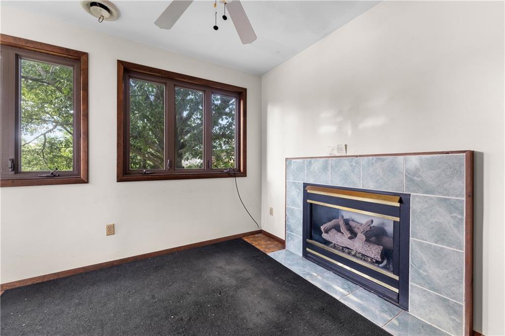 914 Bower Hill Road Pittsburgh, PA 15243 - Photo 13 of 30 a living room with a fireplace with a large window