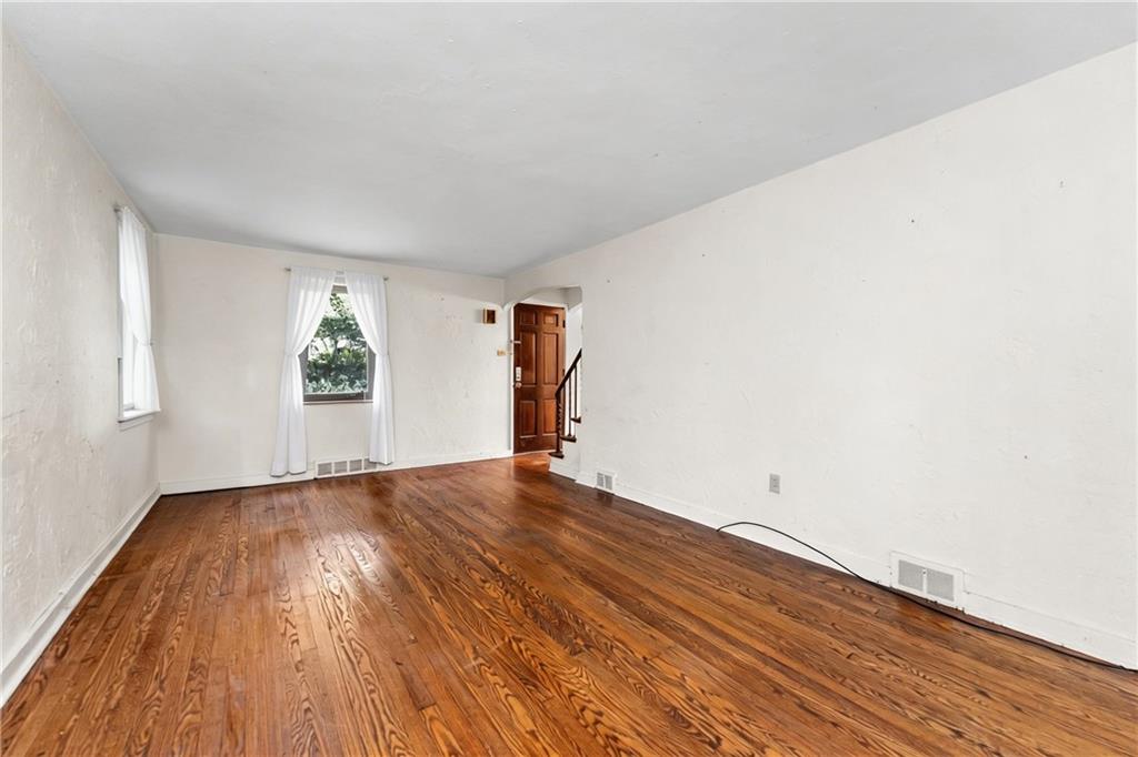 914 Bower Hill Road Pittsburgh, PA 15243 - Photo 4 of 30 a view of empty room with wooden floor and fan
