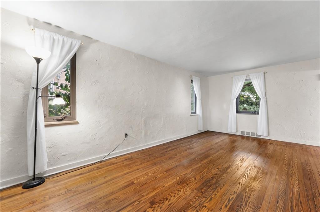 914 Bower Hill Road Pittsburgh, PA 15243 - Photo 6 of 30 an empty room with wooden floor and windows