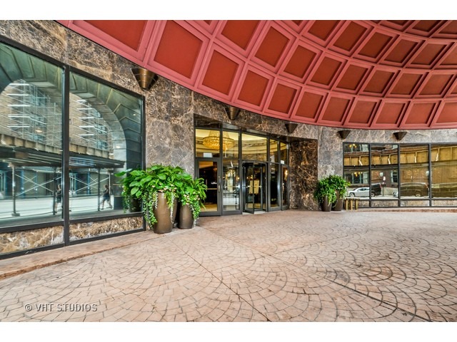 10 East Ontario Street, Unit 1109 Chicago, IL 60611 - Photo 1 of 11 a view of a backyard with a large tree