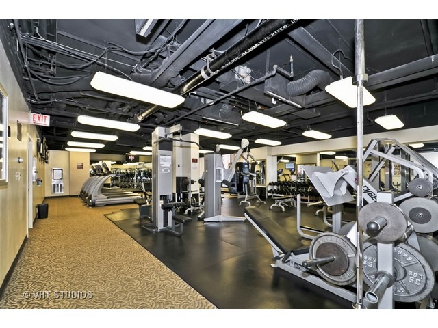 10 East Ontario Street, Unit 1109 Chicago, IL 60611 - Photo 7 of 11 a view of a room with gym equipment