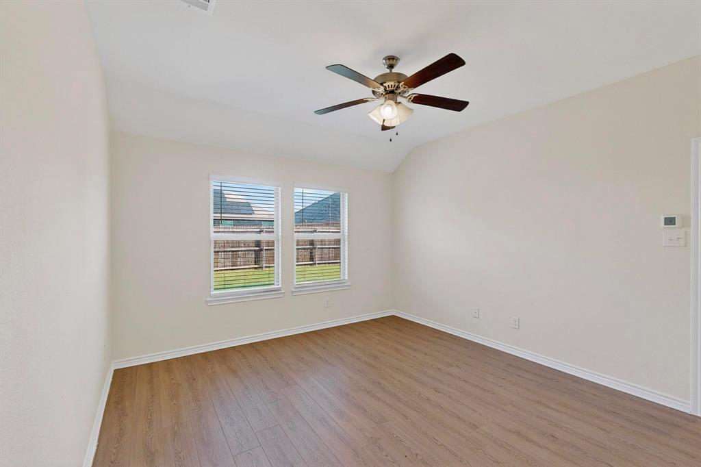408 Rawhide Way Princeton, TX 75407 - Photo 17 of 36 a view of a room with wooden floor and windows