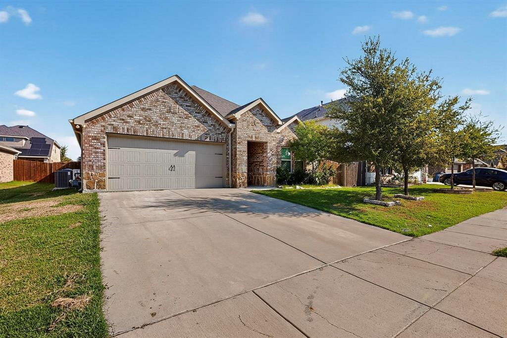 408 Rawhide Way Princeton, TX 75407 - Photo 2 of 36 a view of a house with a yard