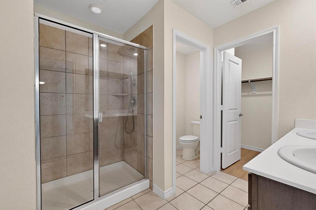 408 Rawhide Way Princeton, TX 75407 - Photo 21 of 36 a bathroom with a shower and a sink