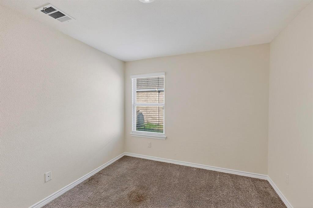 408 Rawhide Way Princeton, TX 75407 - Photo 22 of 36 an empty room with windows