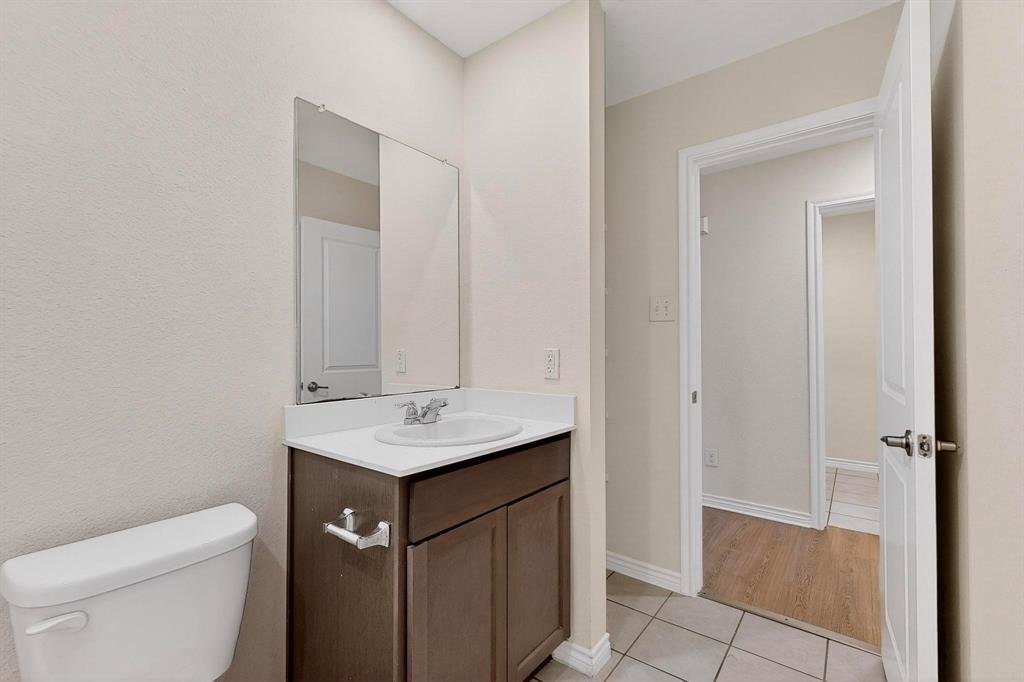 408 Rawhide Way Princeton, TX 75407 - Photo 25 of 36 a bathroom with a sink toilet and vanity