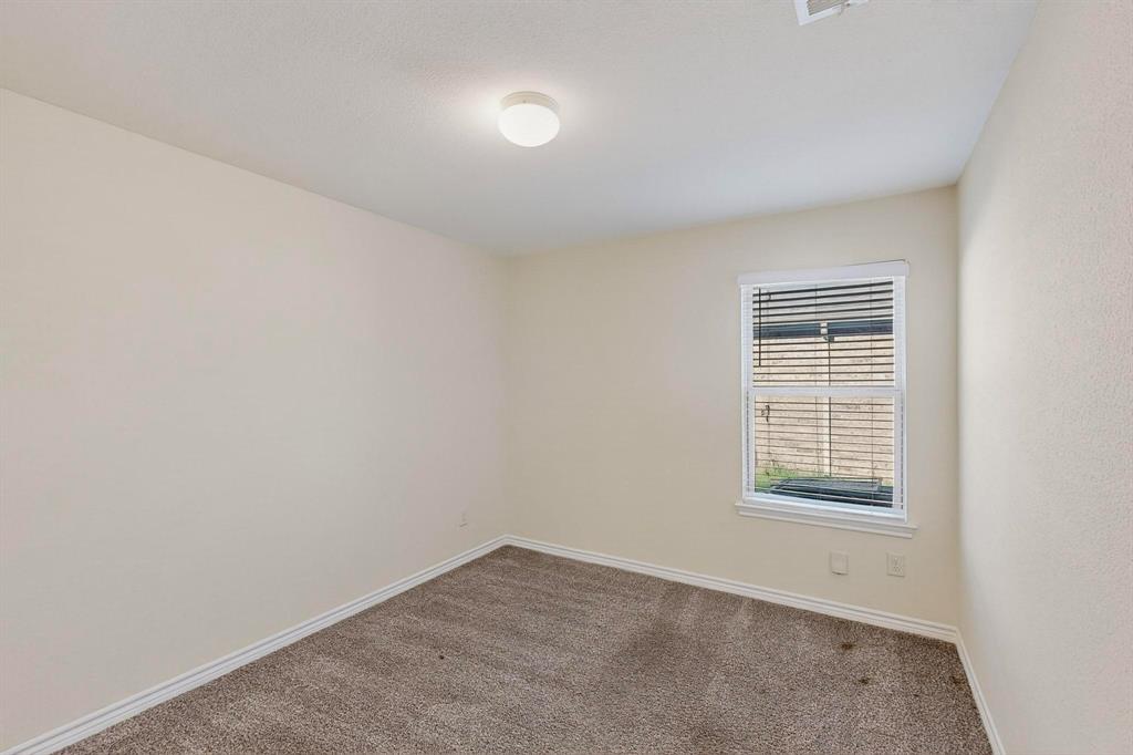 408 Rawhide Way Princeton, TX 75407 - Photo 27 of 36 an empty room with a window