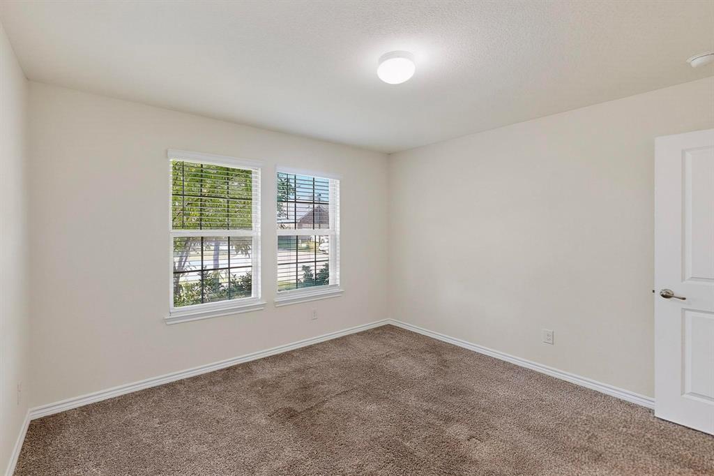 408 Rawhide Way Princeton, TX 75407 - Photo 31 of 36 an empty room with a window