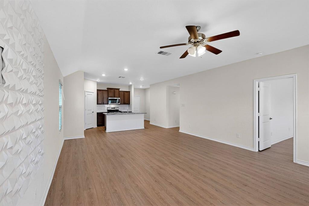 408 Rawhide Way Princeton, TX 75407 - Photo 9 of 36 a view of a living room with a ceiling fan