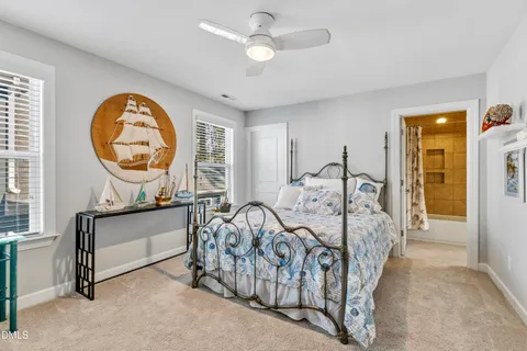a view of a bedroom with furniture