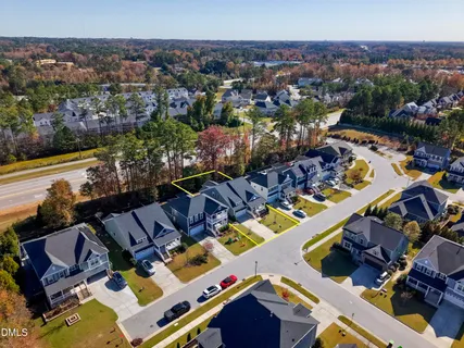 an aerial view of a house with a ocean view