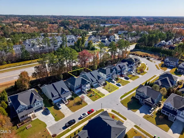 an aerial view of a house with a ocean view