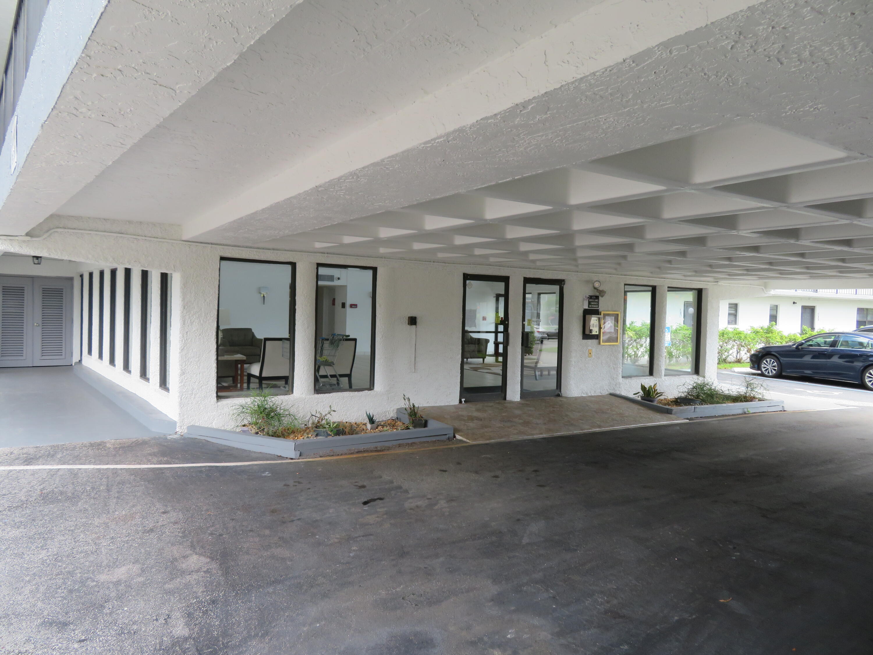 9233 Southwest 8th Street, Unit 122 Boca Raton, FL 33428 - Photo 6 of 44 9_9233_Bldg._Lobby_Entry