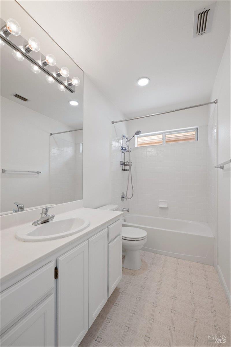 1028 Addison Circle Petaluma, CA 94952 - Photo 29 of 60 a bathroom with a sink a toilet and shower