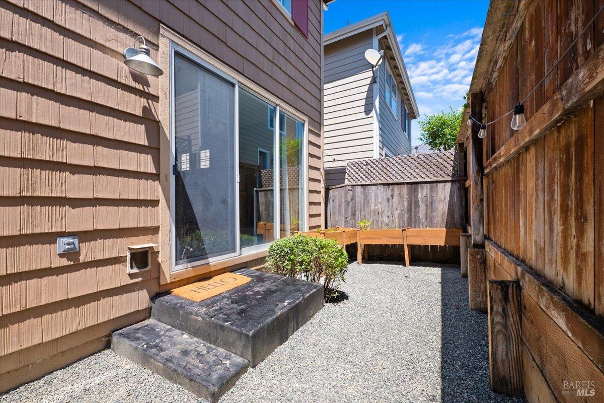 1028 Addison Circle Petaluma, CA 94952 - Photo 43 of 60 a view of balcony with wooden floor and a potted plant