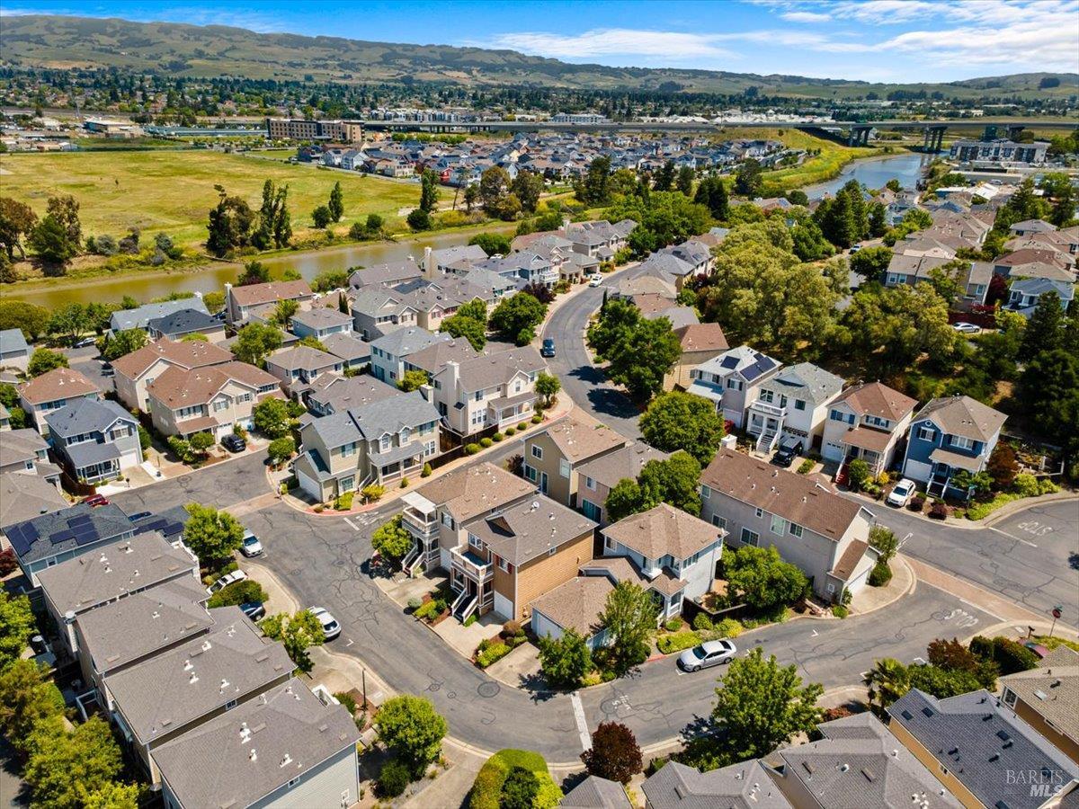 1028 Addison Circle Petaluma, CA 94952 - Photo 49 of 60 an aerial view of a city with lots of residential buildings and mountain view in back