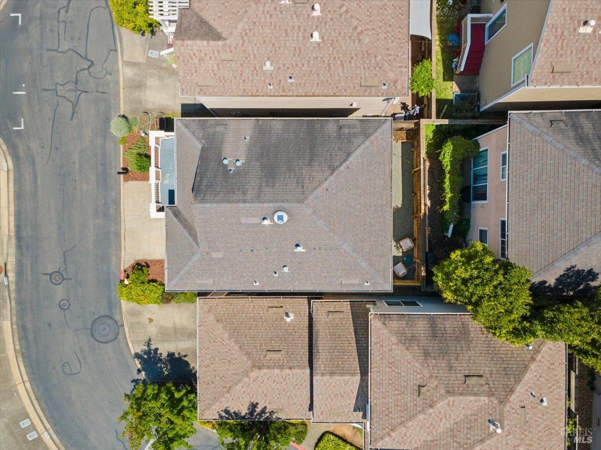 1028 Addison Circle Petaluma, CA 94952 - Photo 55 of 60 an aerial view of a house with a yard and large trees