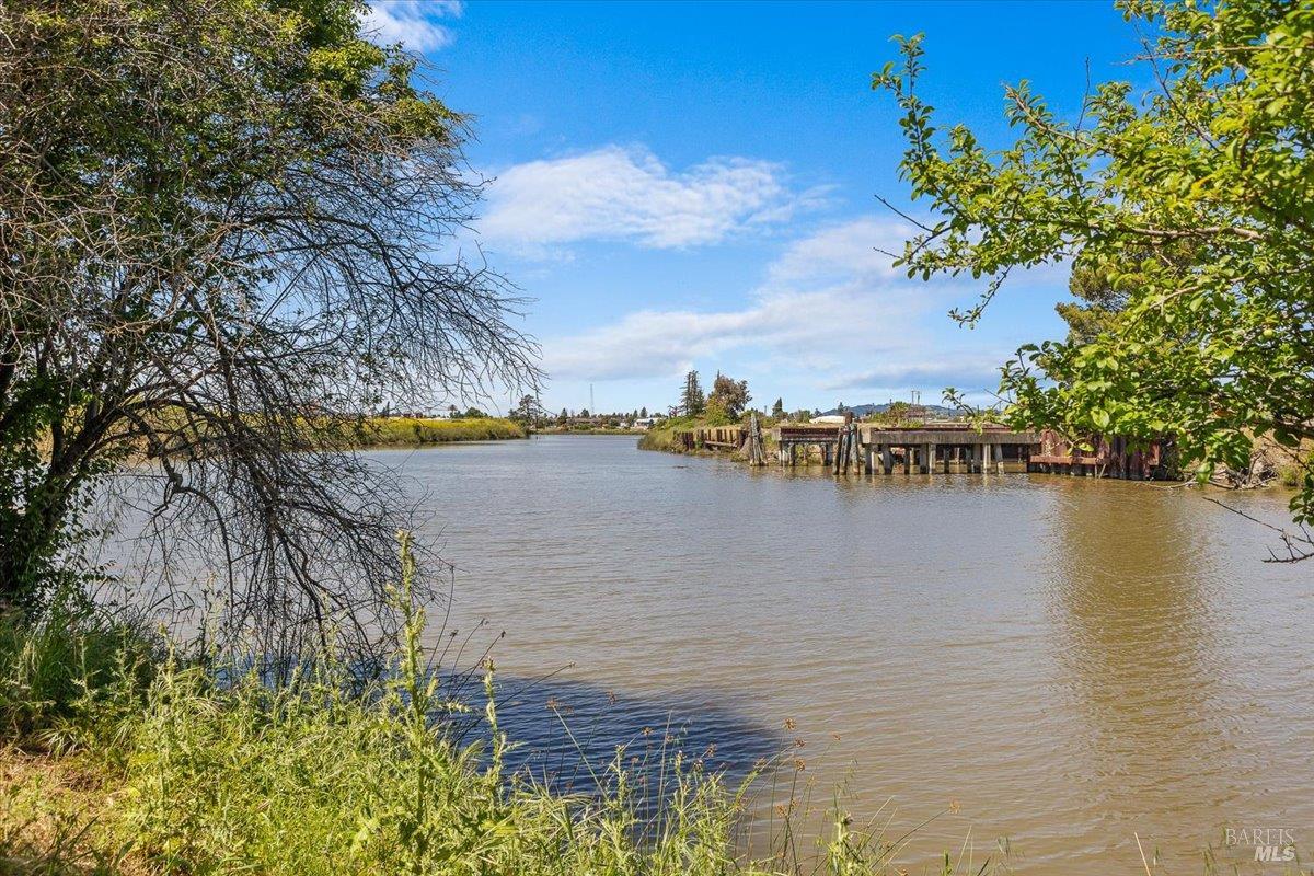1028 Addison Circle Petaluma, CA 94952 - Photo 56 of 60 a view of a lake with a building in the background