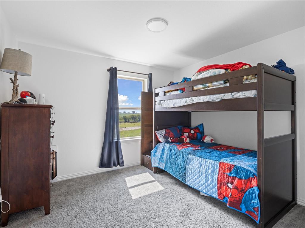 781 Alsdorf Road Ennis, TX 75119 - Photo 10 of 39 a bedroom with bed and a window