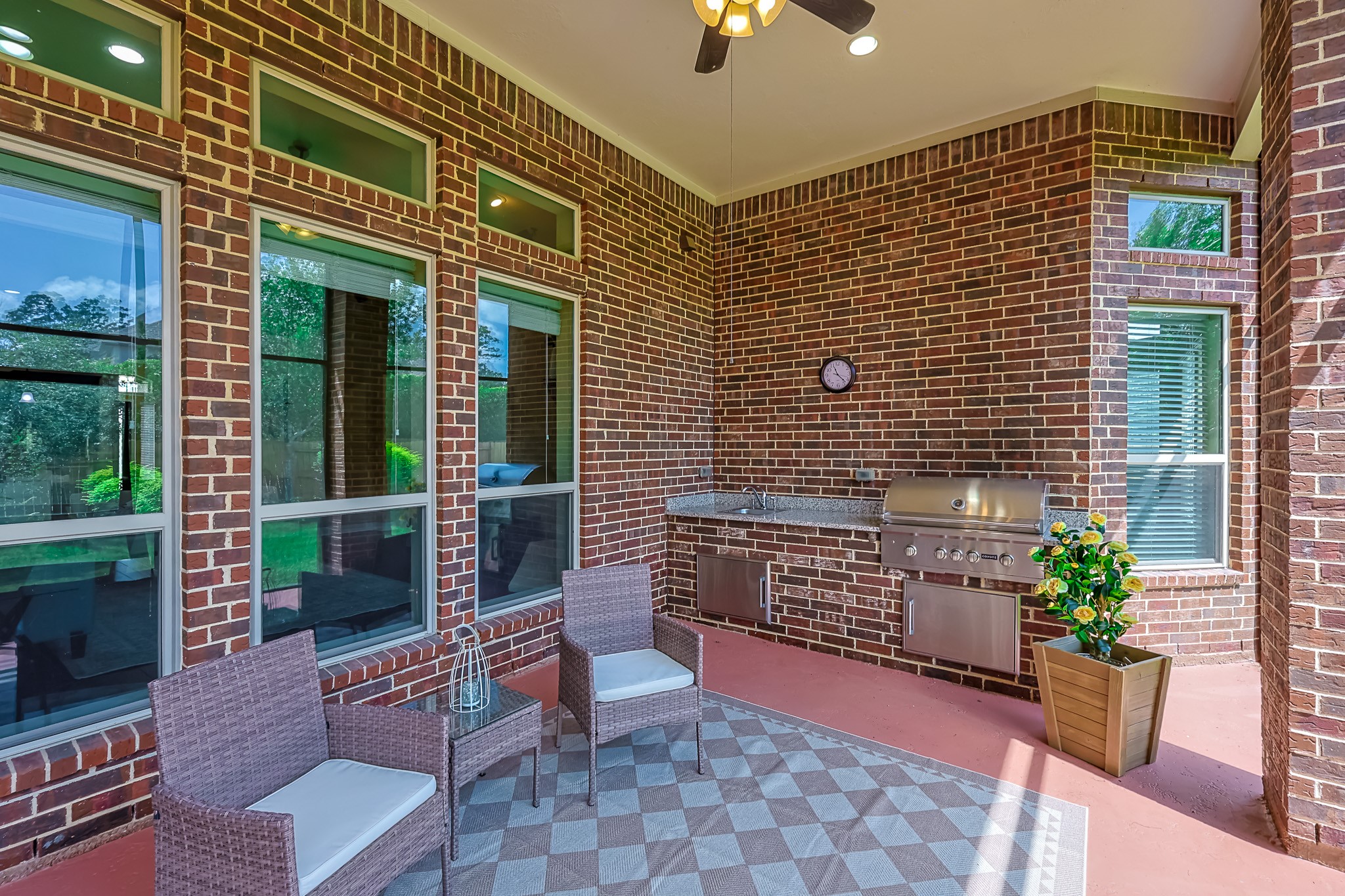 515 Mill Creek Road Pinehurst, TX 77362 - Photo 39 of 48 This photo showcases a cozy screened in outdoor patio, featuring a built-in grill and counter space.