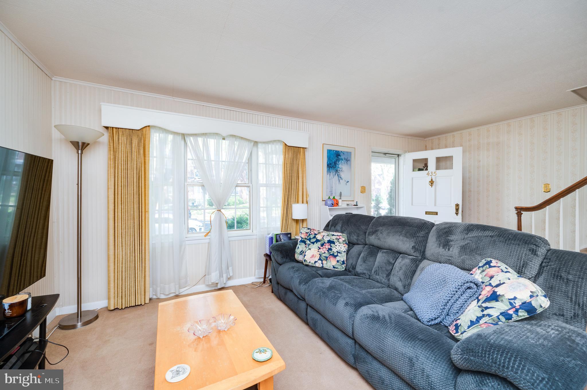 435 Sycamore Road Reading, PA 19611 - Photo 11 of 42 a living room with furniture and a flat screen tv