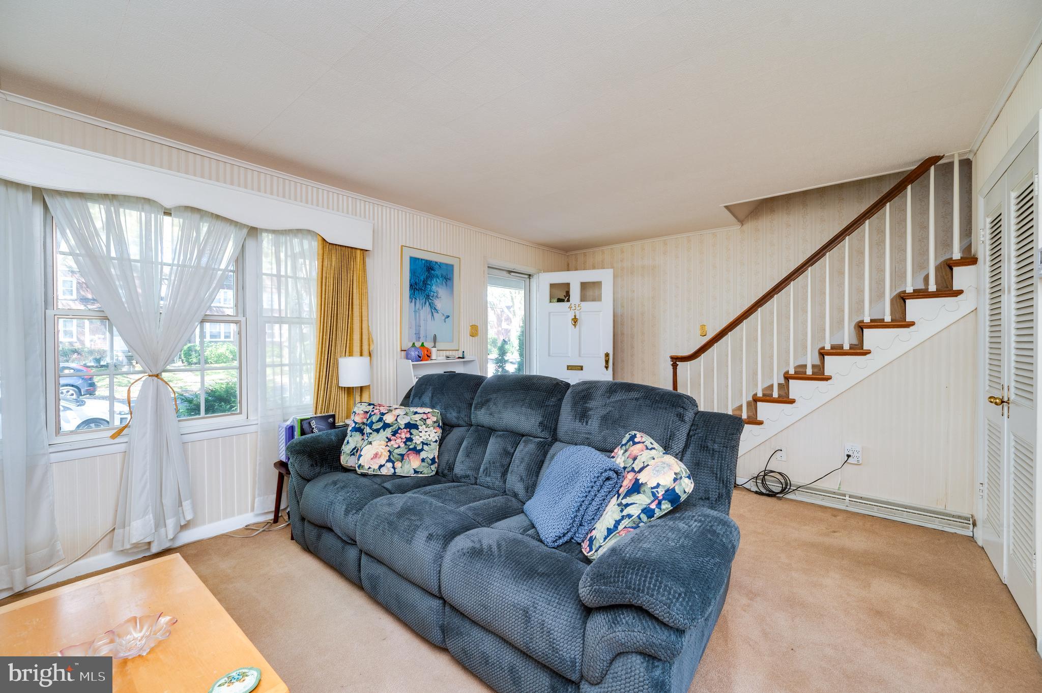 435 Sycamore Road Reading, PA 19611 - Photo 13 of 42 a living room with furniture and a large window