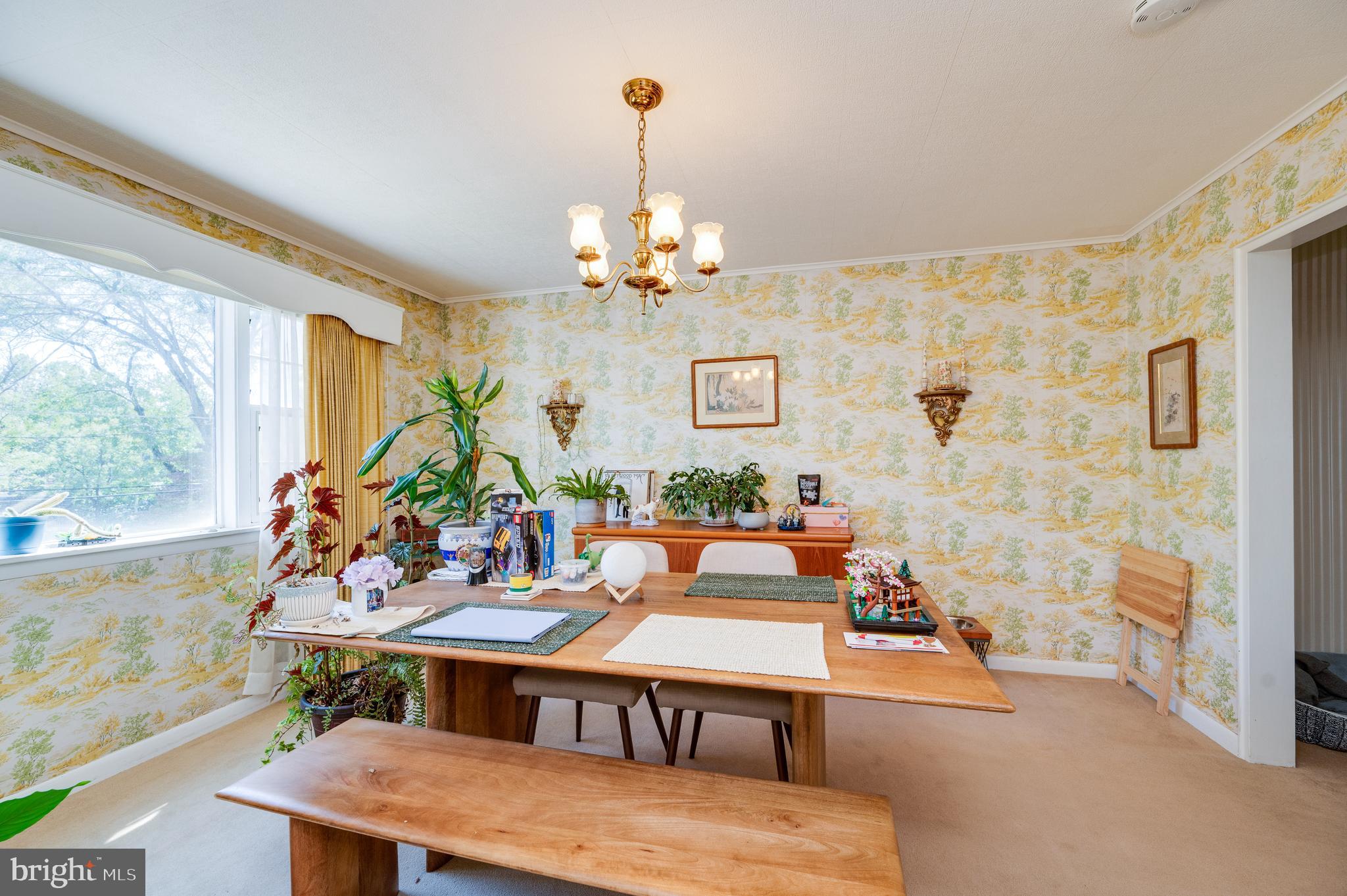 435 Sycamore Road Reading, PA 19611 - Photo 17 of 42 a view of a dining room with furniture and a chandelier