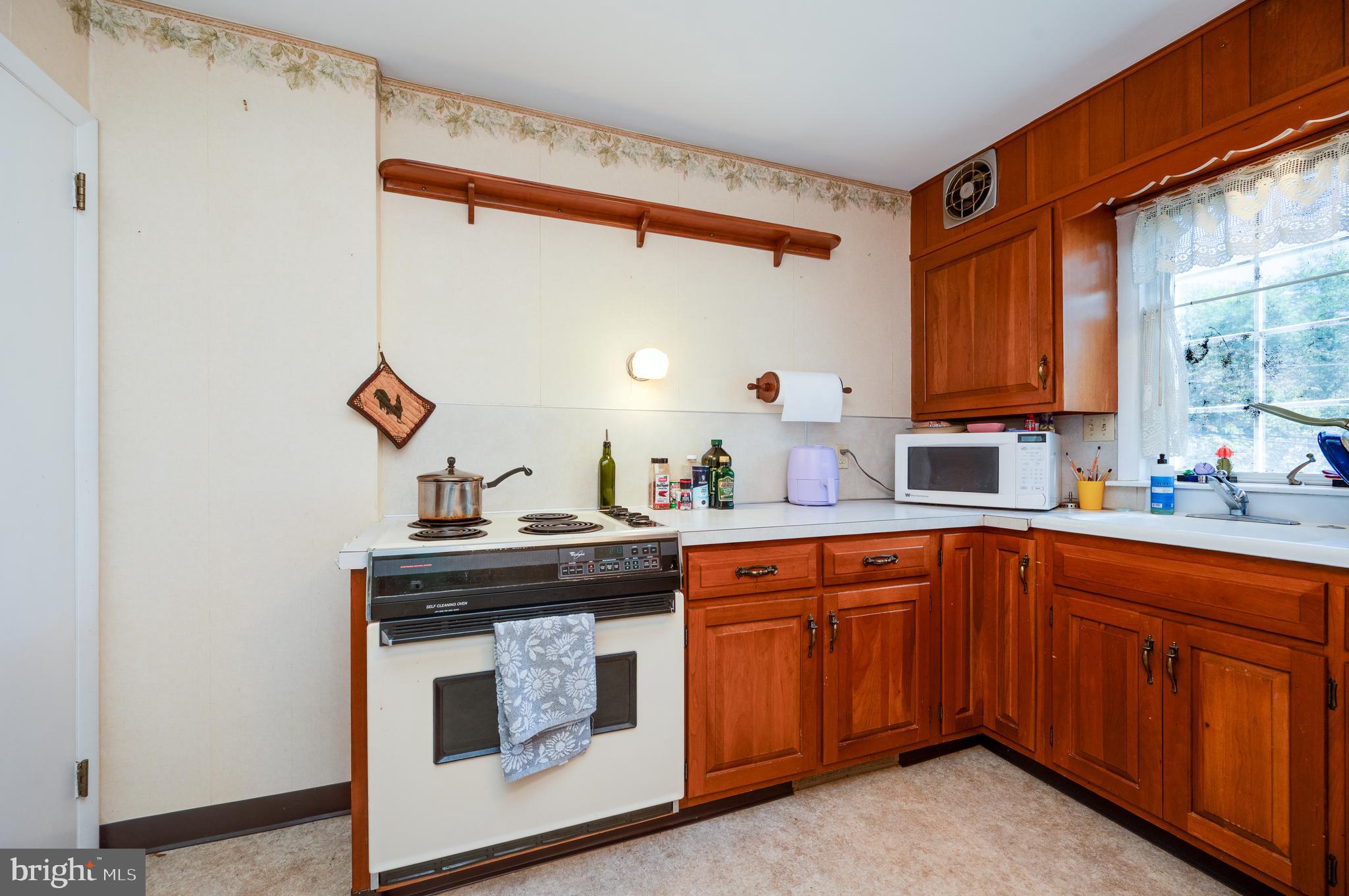 435 Sycamore Road Reading, PA 19611 - Photo 18 of 42 a kitchen with a sink and cabinets