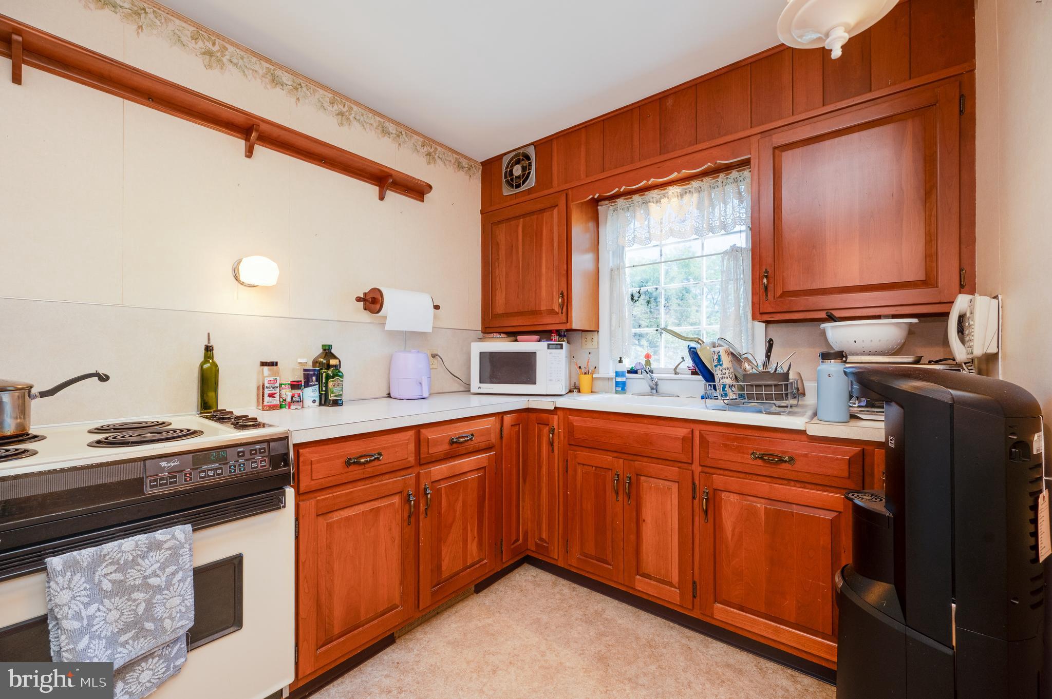 435 Sycamore Road Reading, PA 19611 - Photo 19 of 42 a kitchen with stainless steel appliances granite countertop a sink stove and cabinets