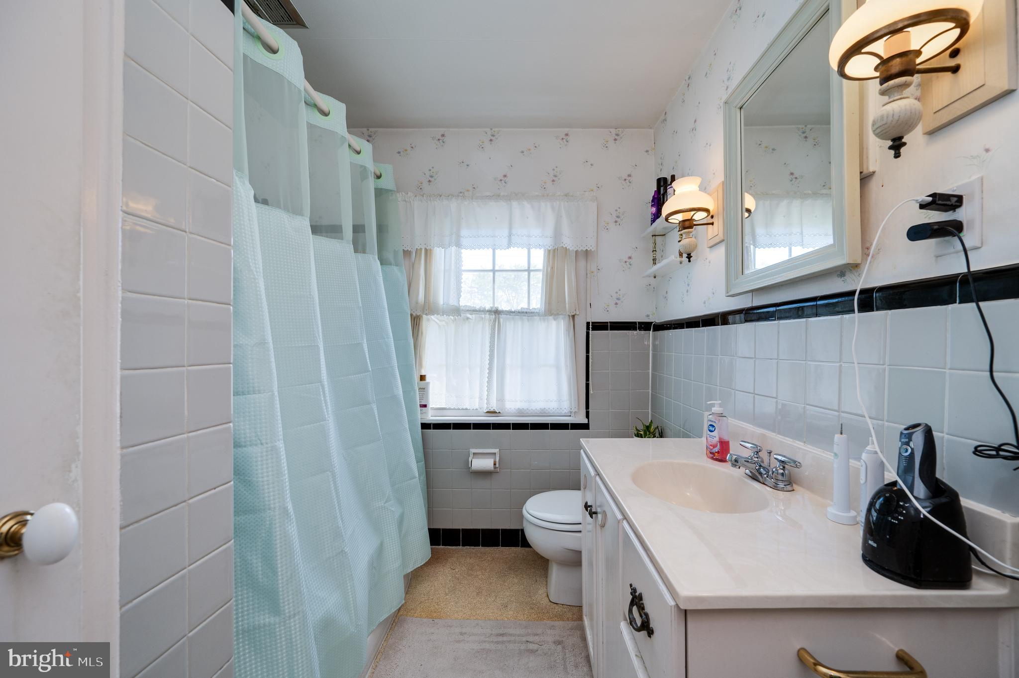 435 Sycamore Road Reading, PA 19611 - Photo 27 of 42 a bathroom with a sink a toilet and shower