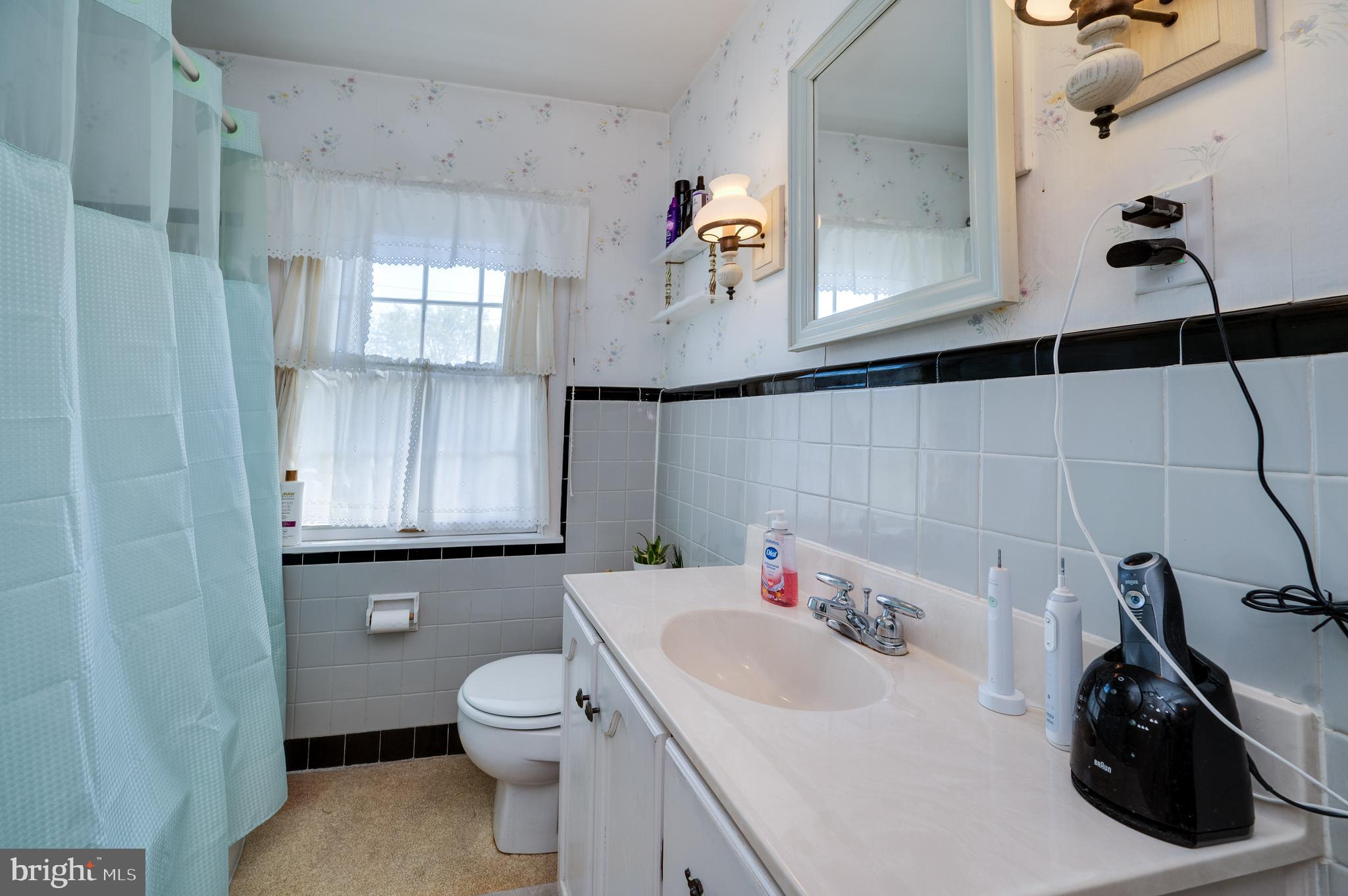 435 Sycamore Road Reading, PA 19611 - Photo 28 of 42 a bathroom with a sink a toilet and shower
