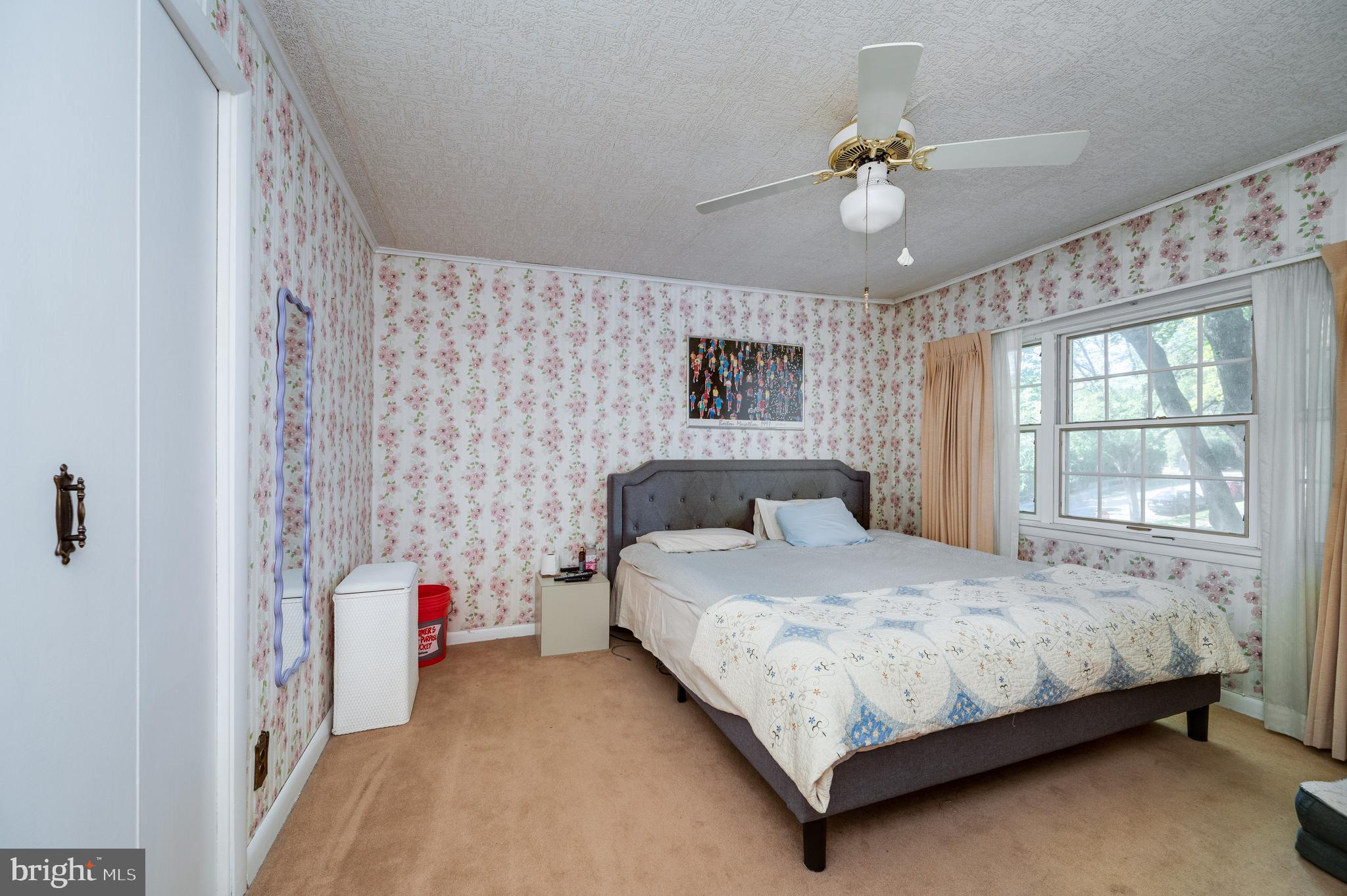435 Sycamore Road Reading, PA 19611 - Photo 30 of 42 a bedroom with a bed and a chandelier