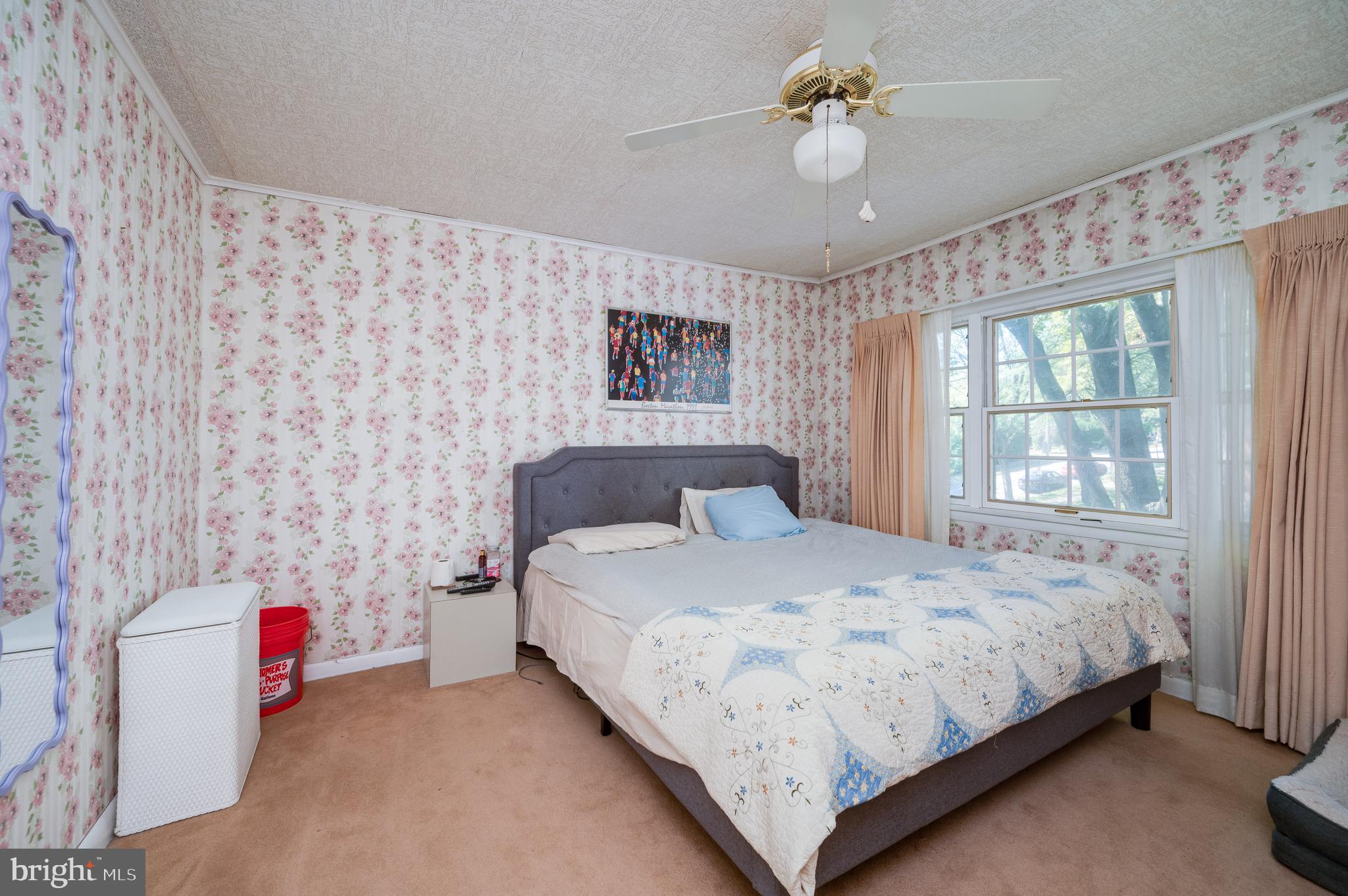 435 Sycamore Road Reading, PA 19611 - Photo 31 of 42 a bedroom with a bed and a chandelier