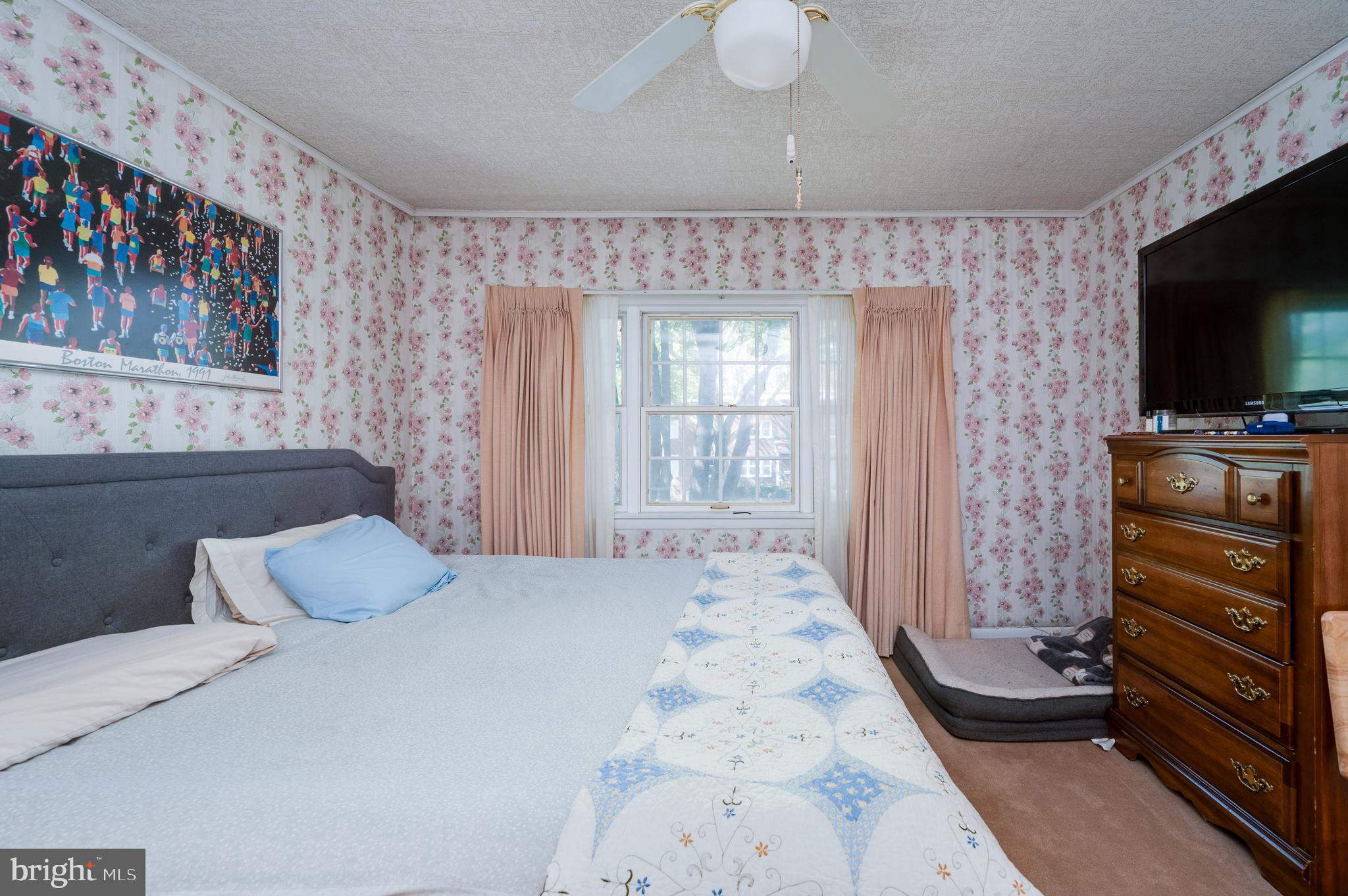 435 Sycamore Road Reading, PA 19611 - Photo 32 of 42 a bedroom with a bed and a flat screen tv