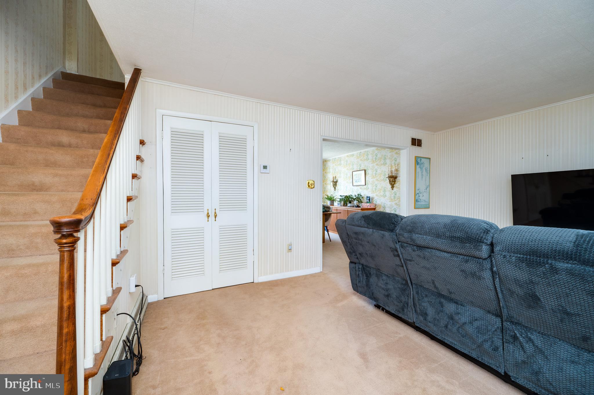 435 Sycamore Road Reading, PA 19611 - Photo 6 of 42 a living room with furniture and a flat screen tv